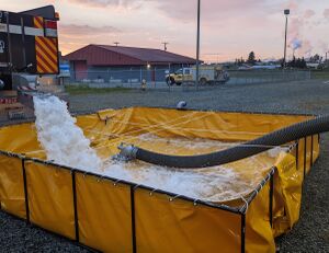 3000 gallon drop tank filling with hard suction attached